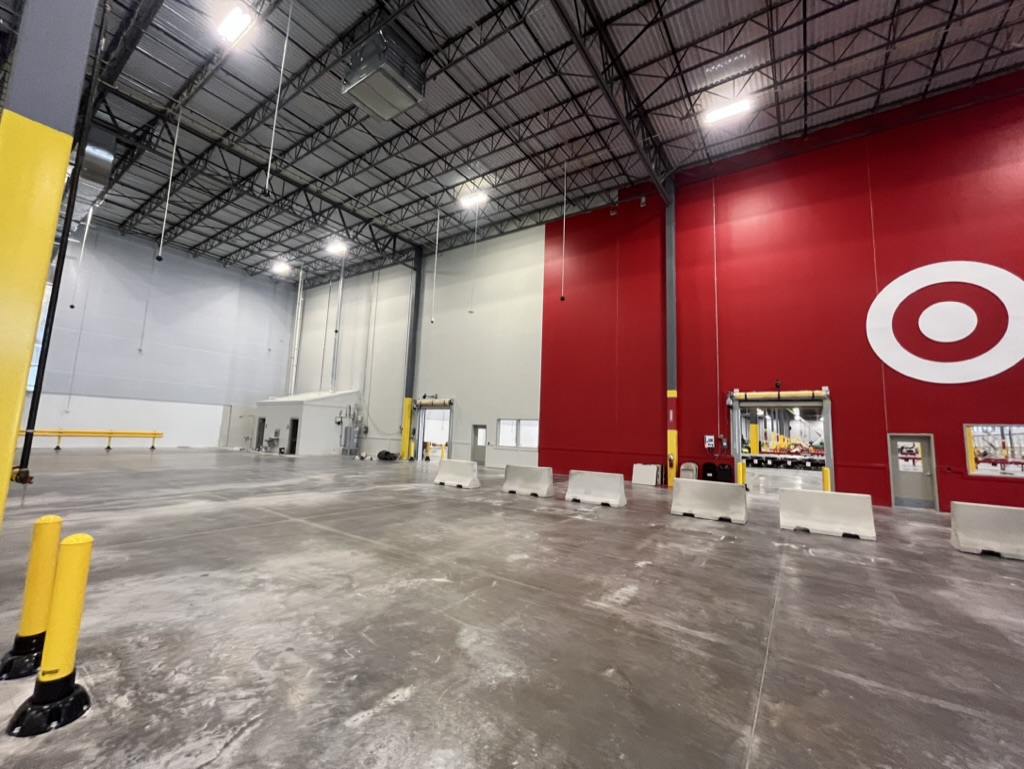 Large commercial warehouse repaint with a clean finished feature wall