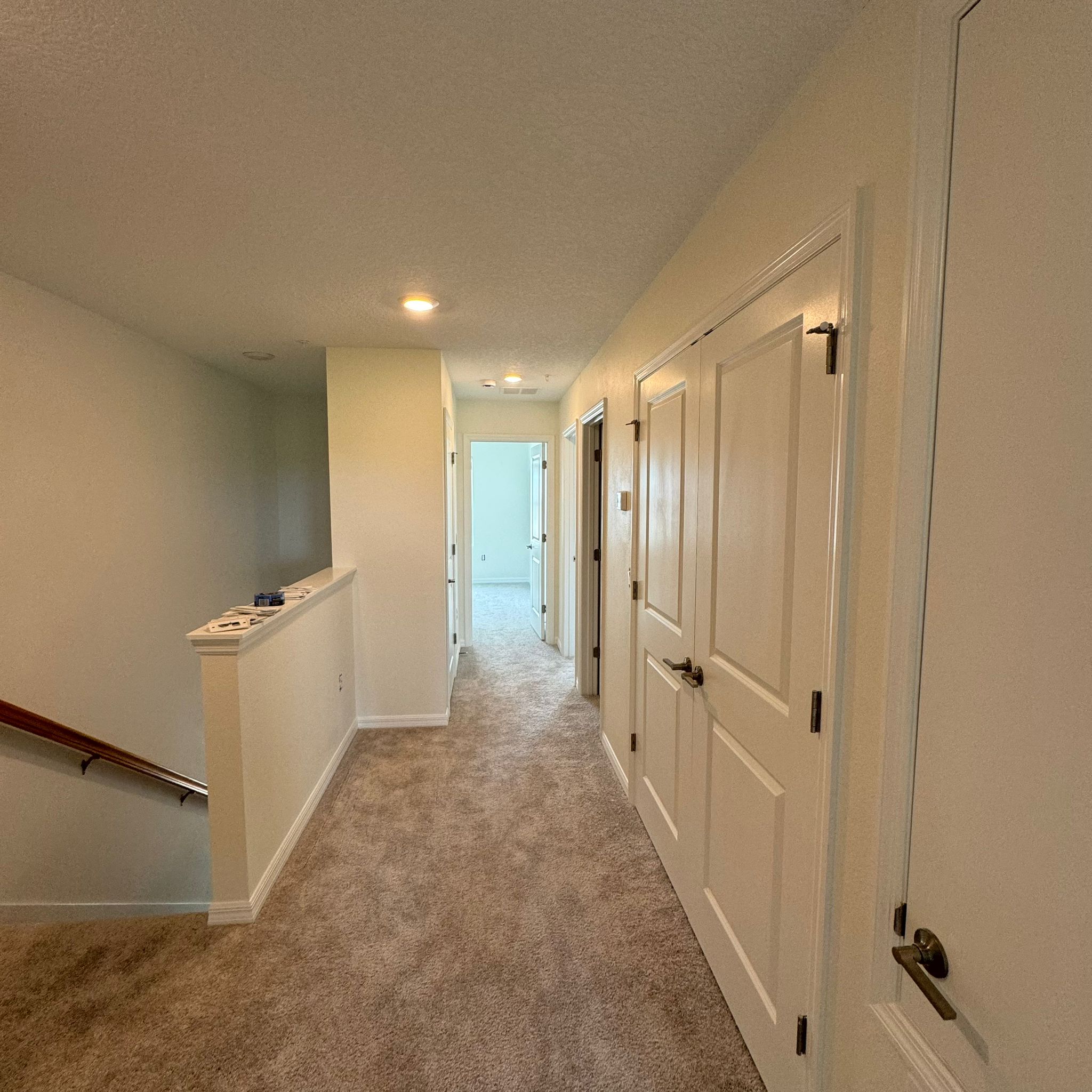 Freshly painted hallway with crisp white doors and trim